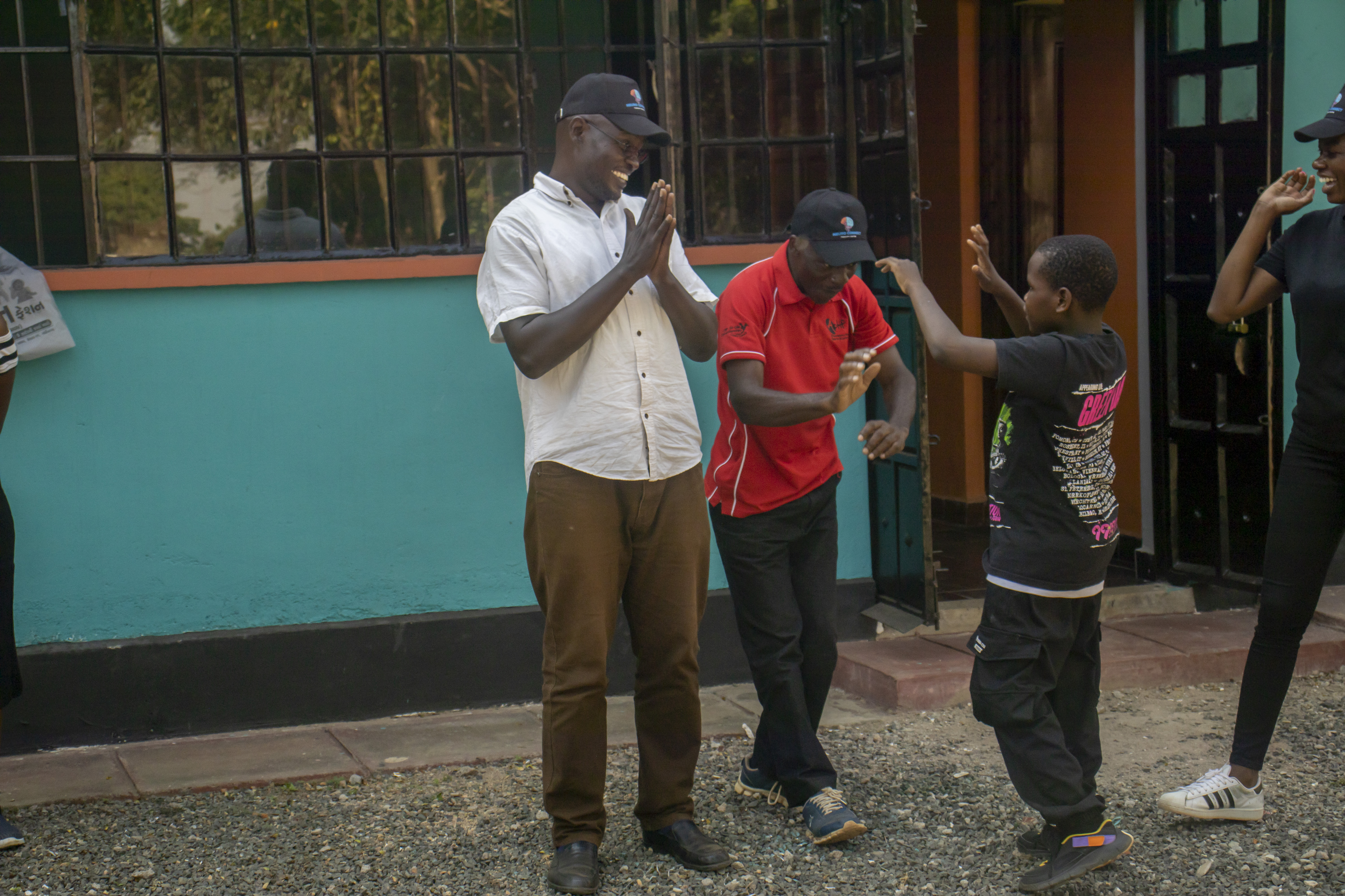 Staff and children interacting outside the therapy centre